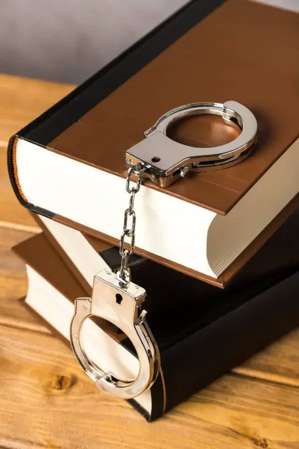 close-up-with-handcuffs-books